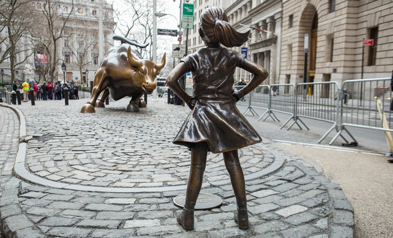 famous bronze fearless girl with wall street bull